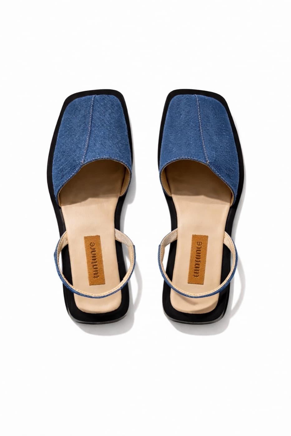 Pair of square-toe slides with denim uppers, seen from above